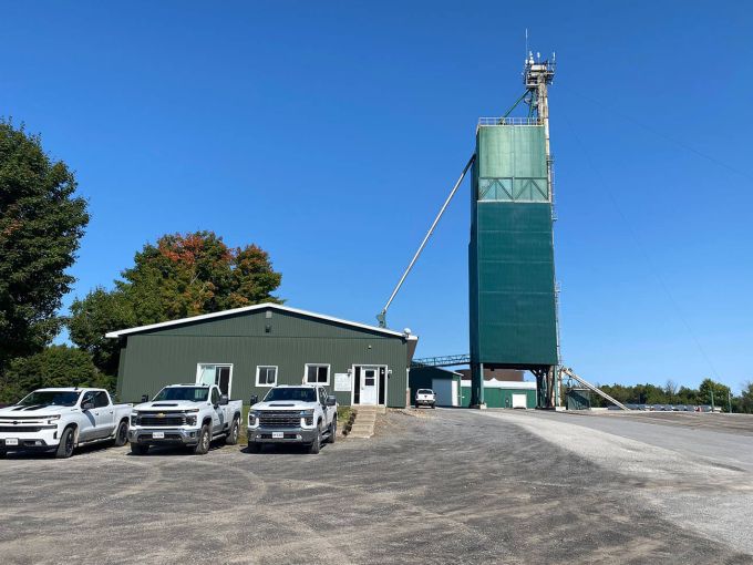 Harvex facilities with trucks and blue sky