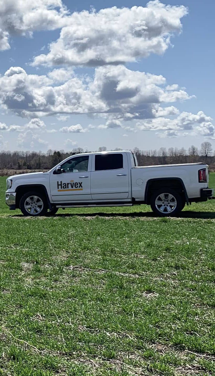 Harvex Truck on crop field with blue sky