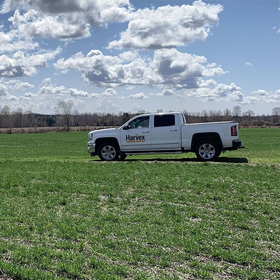 Harvex Truck on crop field with blue sky